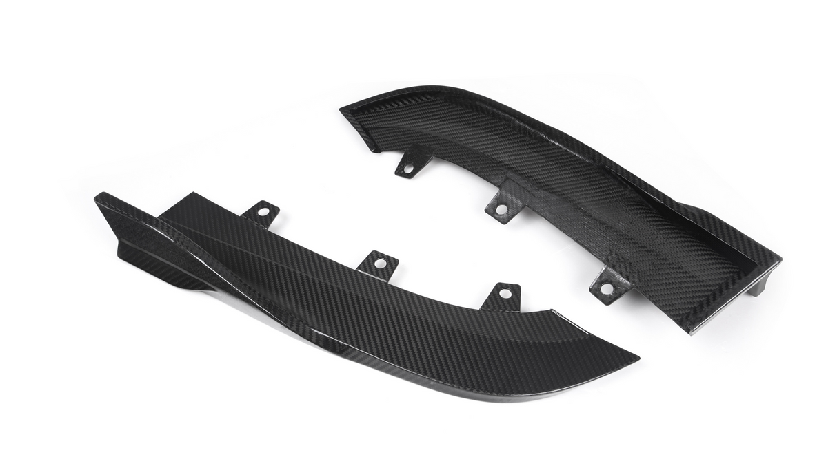 Two carbon fiber car parts with curved designs rest on a white background, featuring multiple mounting points.