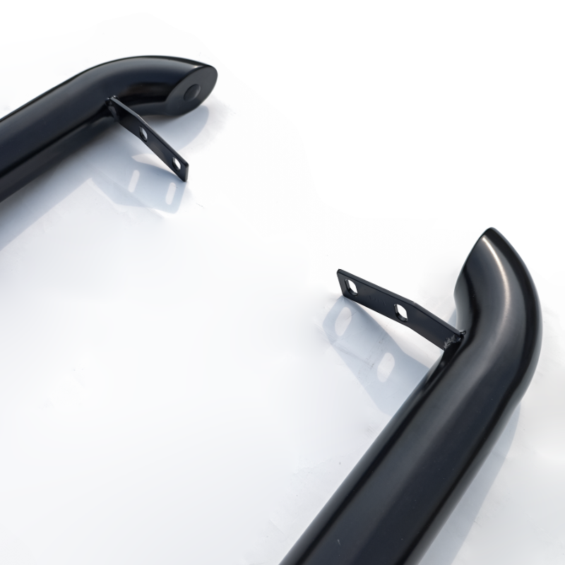 Two curved black metal bars with mounting brackets are positioned on a glossy white surface, suggesting components for attachment or support in engineering or automotive applications.