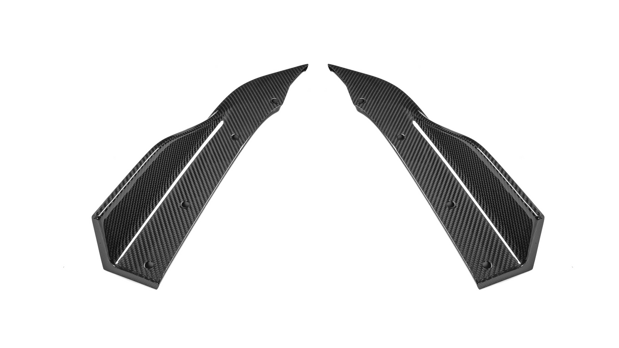 Two elongated, symmetrical carbon fiber components with curved edges and drilled holes are positioned facing each other against a plain, white background.