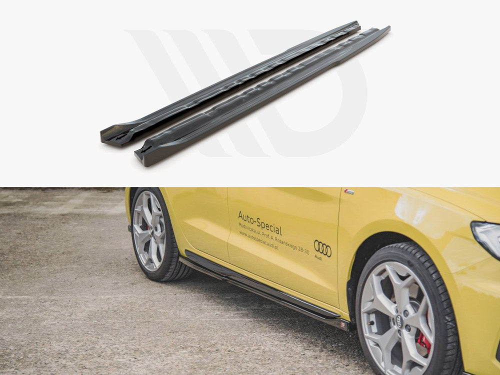 Two black car side skirts are displayed above a yellow Audi with silver wheels parked on gravel. The car has "Auto-Special" text and a website, www.auto-specialaudi.pl, on the side.