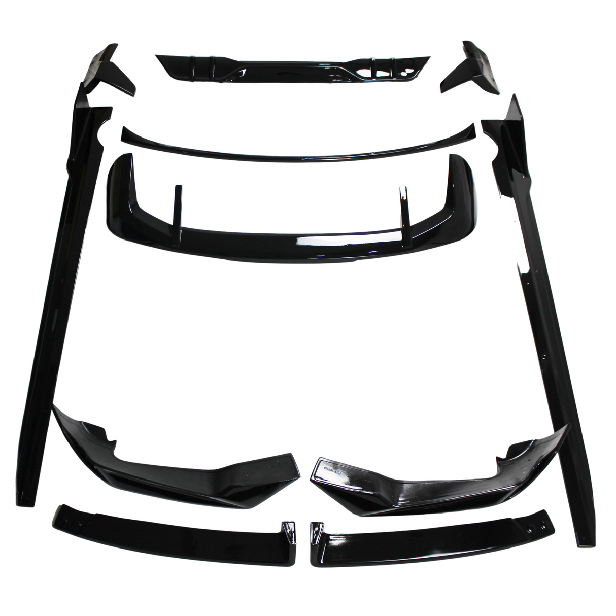 Black car body kit components, including spoilers and side skirts, are arranged on a white background. The parts are neatly organized, showcasing their glossy finish and aerodynamic design.