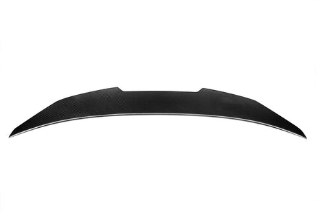 A sleek, black carbon fiber car spoiler rests on a plain white background, showcasing a smooth, aerodynamic curve with tapered ends.