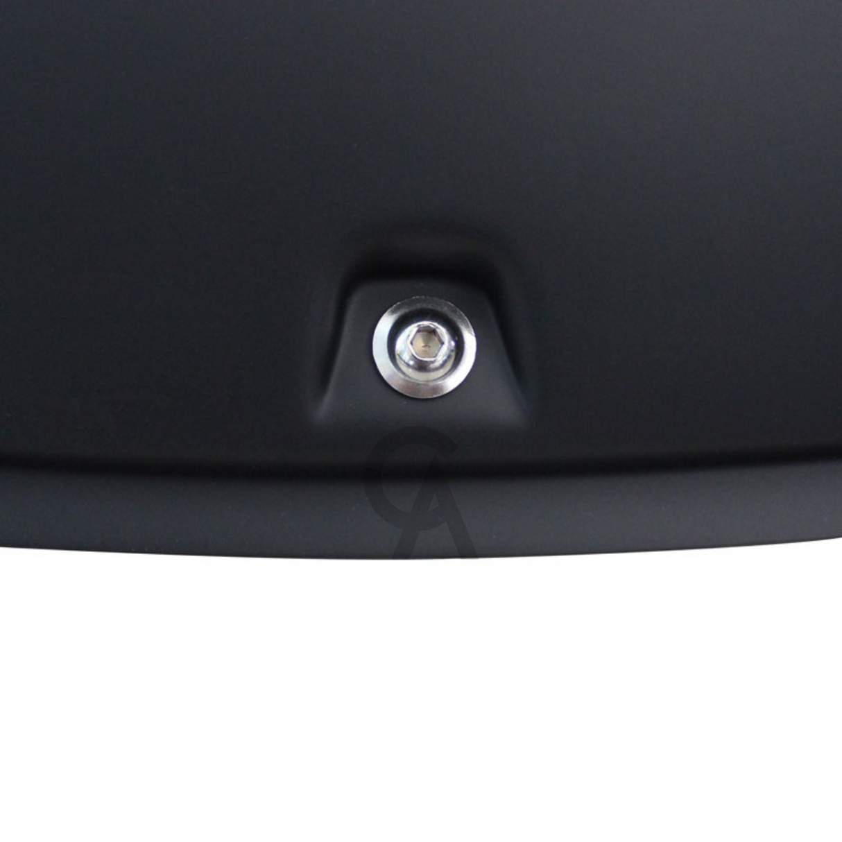 A metallic screw is securely embedded in a smooth, matte black surface. The setting appears industrial, suggesting it may be part of equipment or machinery.