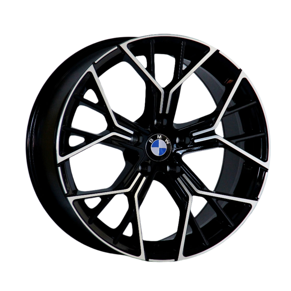 A black and metallic car wheel rim features a geometric spoke design, displaying a centrally placed BMW logo. The rim is isolated on a white background.