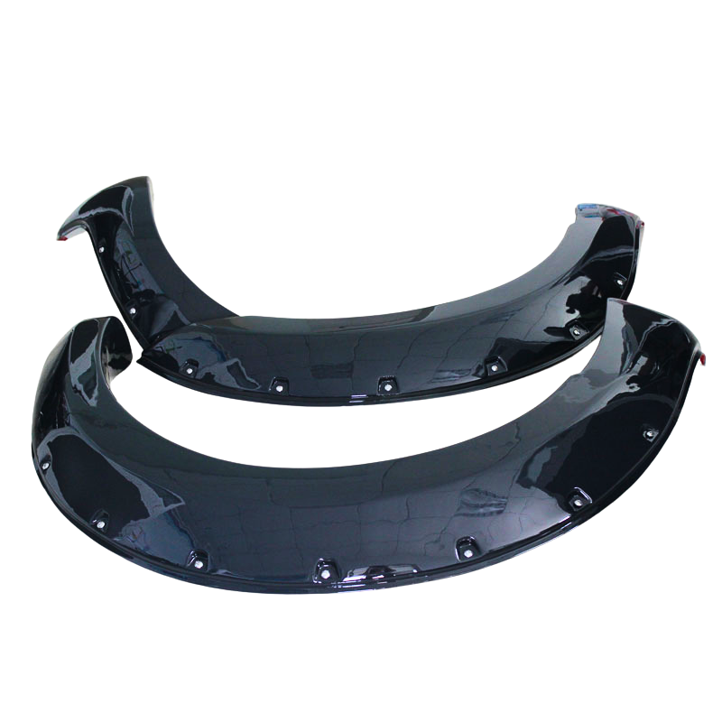 Two glossy black car fender flares lay on a plain white background. Each flare features multiple rivet holes along the curved edges, designed for vehicle installation.