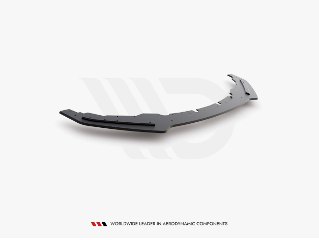 A curved, black aerodynamic car component lies on a plain white surface. Text reads: "WORLDWIDE LEADER IN AERODYNAMIC COMPONENTS."