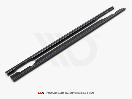 Two long, dark aerodynamic components lay parallel on a white surface. Text below reads, "WORLDWIDE LEADER IN AERODYNAMIC COMPONENTS."