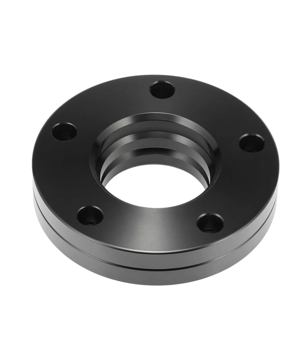 A black metallic flange with five evenly spaced circular holes and a central threaded opening, resting against a plain white background.