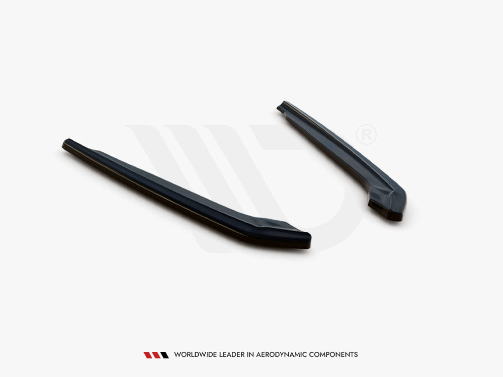 Two elongated, dark aerodynamic components lie parallel on a white surface. Text below reads, "WORLDWIDE LEADER IN AERODYNAMIC COMPONENTS."