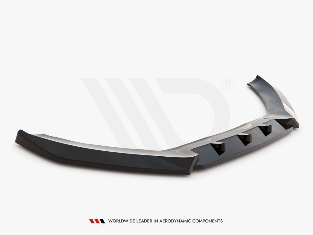 A black, angular car spoiler rests on a white surface, featuring multiple triangular cutouts. Text below reads: "WORLDWIDE LEADER IN AERODYNAMIC COMPONENTS."