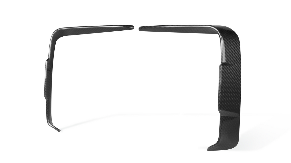 Two carbon fiber car dash trims are positioned vertically, facing each other, against a plain white background.