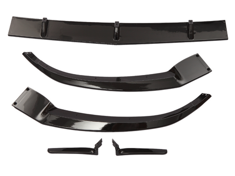 Five glossy black car spoiler components are laid on a white background. They vary in size and shape, indicating they are parts of a vehicle aerodynamic kit.