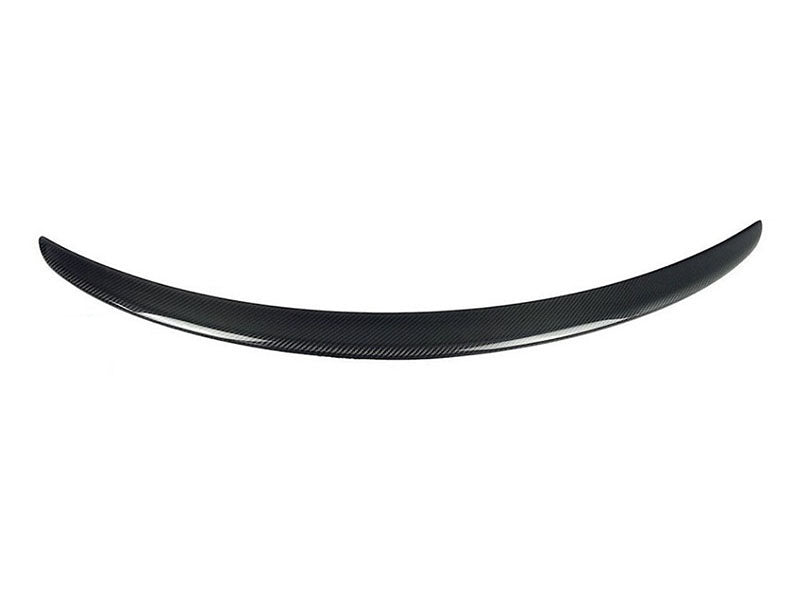 A curved carbon-fiber car spoiler rests on a plain white background, showcasing its sleek, aerodynamic form. No text is present.