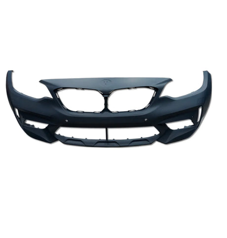 A black car front bumper with large central grille openings is displayed against a plain white background. The bumper is symmetrical with spaces for headlights on each side.