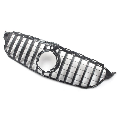 A glossy black car grille with vertical slats features a central circular emblem area. It's set against a plain, light background, emphasizing its sleek design.