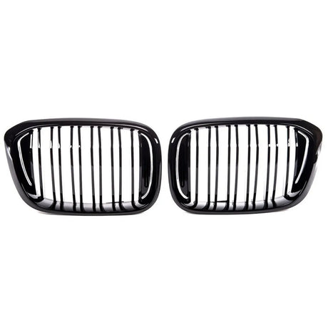 Two black car grilles with vertical slats, aligned side by side against a white background, commonly used as front-end design elements for vehicle air intake and styling.