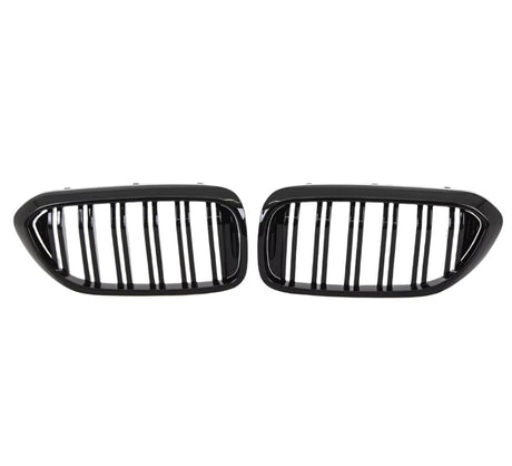 Two black, oval car grilles with vertical bars sit side by side against a white background, indicating they are designed for a vehicle's front end.