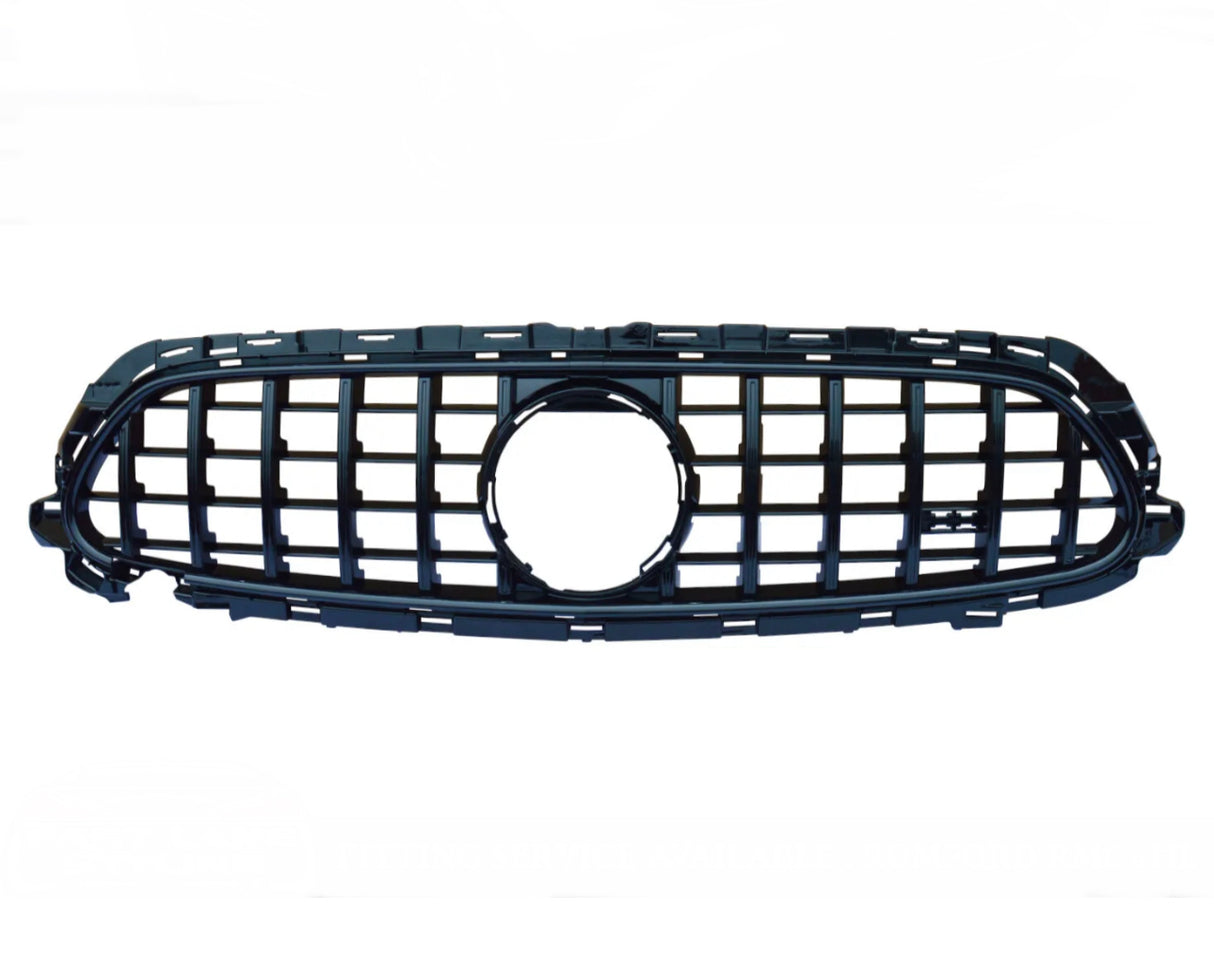 A black plastic car grille with a honeycomb pattern and an emblem cutout rests against a plain white background.