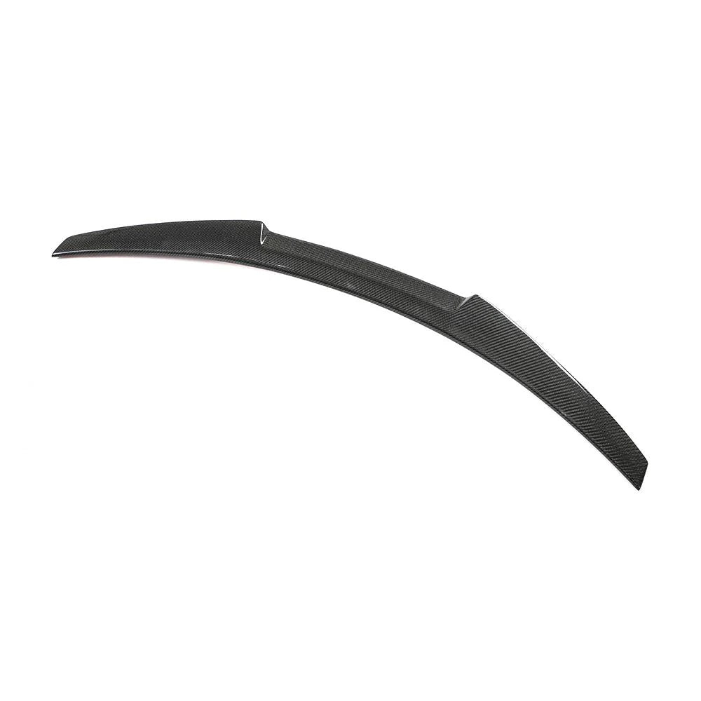 A curved carbon fiber automotive spoiler rests on a white background, featuring a sleek design with diagonal patterns and a raised middle section.