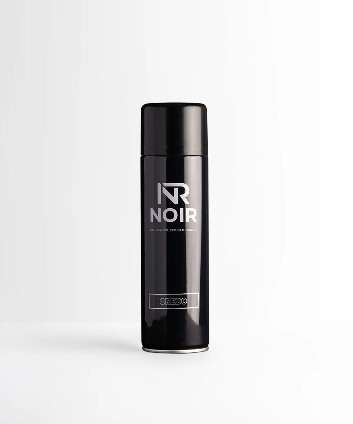 A black aerosol can labeled "NR NOIR" and "CREDO" stands upright, centered on a white background. Text reads: "HIGH PRESSURED DEODORISER."