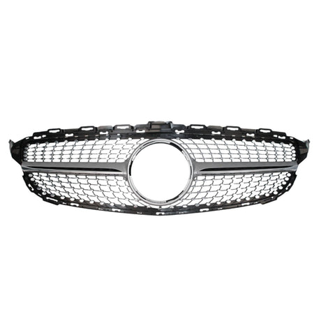 A chrome and black car grille with a honeycomb pattern features a circular emblem space in the center, set against a plain white background.