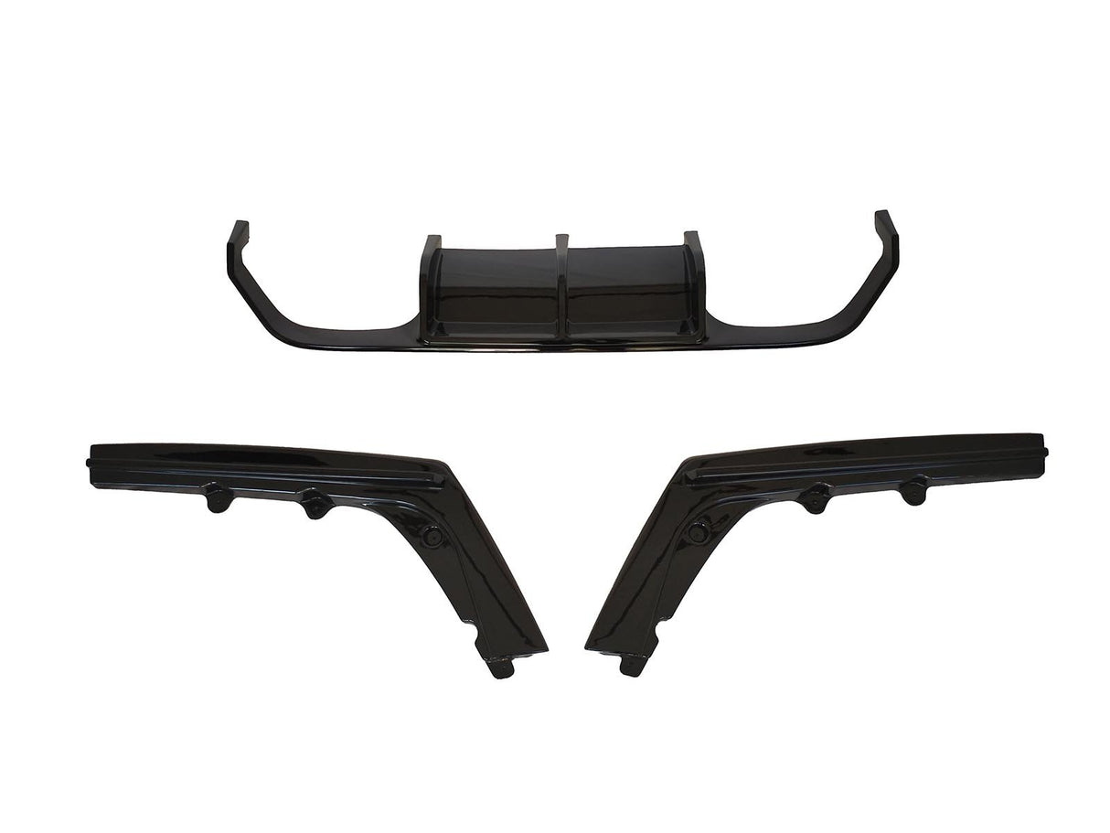 Three black automotive body parts are laid out separately against a white background, comprising a central diffuser and two angled side skirts.