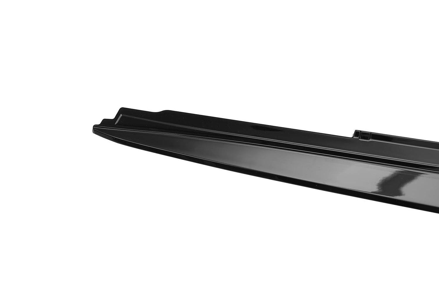 A sleek, black, elongated metallic object rests against a plain white background, possibly part of an automotive or industrial component, with a ridged design on its surface.