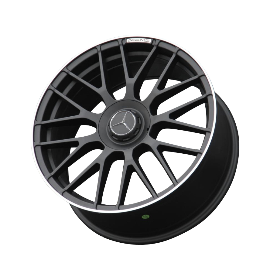 A black alloy car wheel features a silver emblem and multiple spokes, angled upward. It's labeled "AMG" near the rim, set against a plain white background.