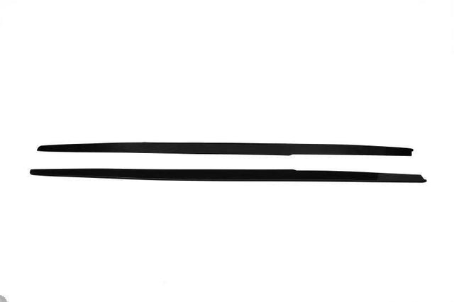 Two long, thin black strips lie parallel on a plain white background, one slightly overlapping the other.