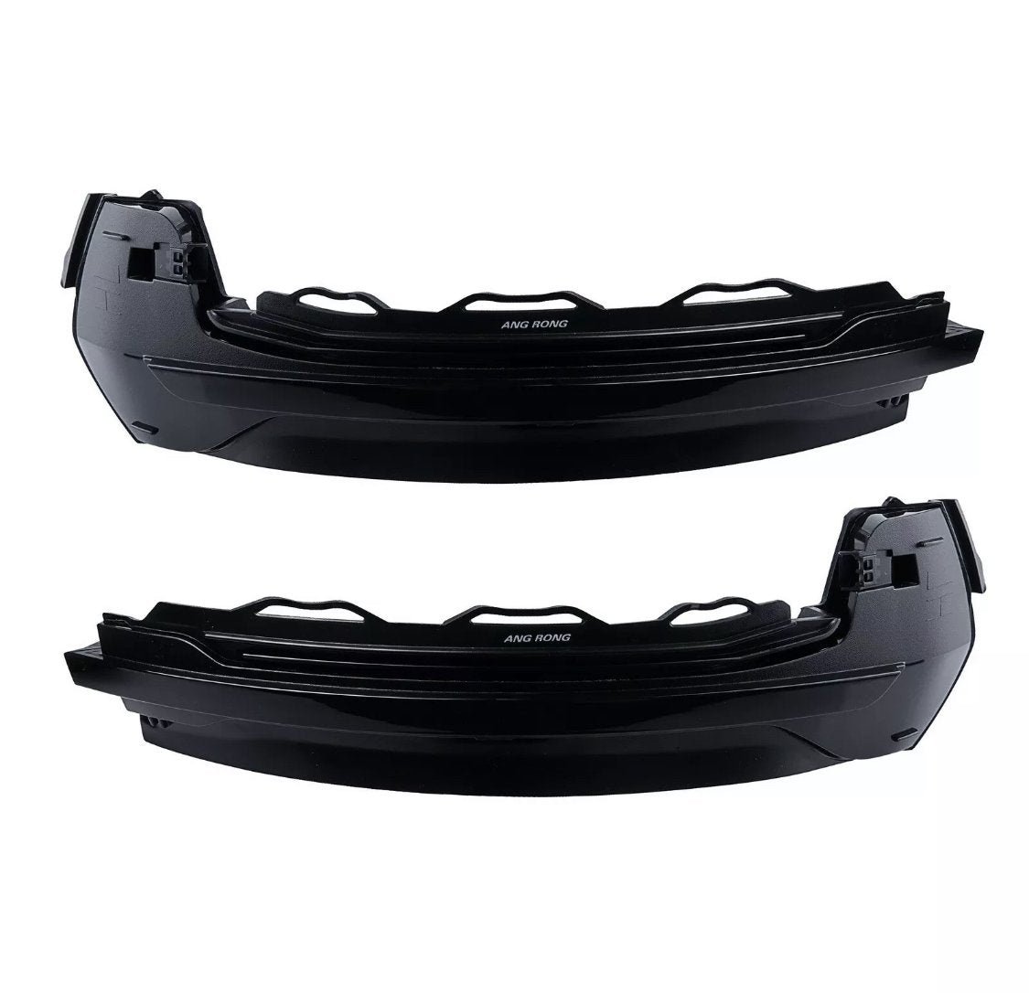 Two black, curved, plastic automotive parts with angular edges are positioned horizontally. Each features the text "ANG RONG" in the center. They are set against a plain white background.