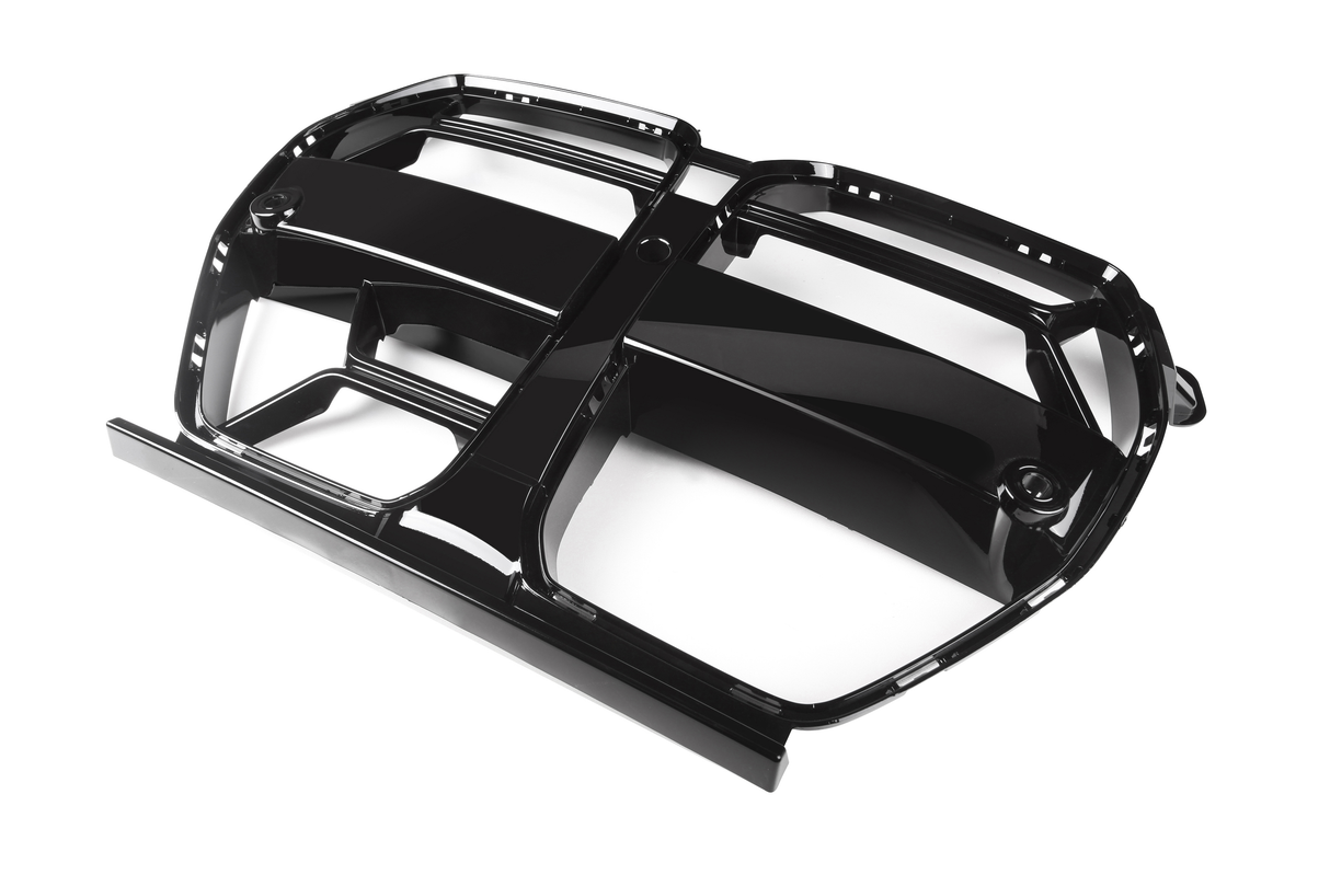 A glossy black car grill with bold lines and rectangular sections, oriented diagonally on a plain white background.