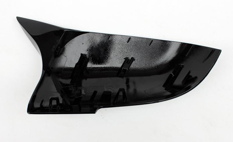 A black, fin-shaped plastic car part with attachment clips sits on a white background. Text on the surface reads: "260 30019R."