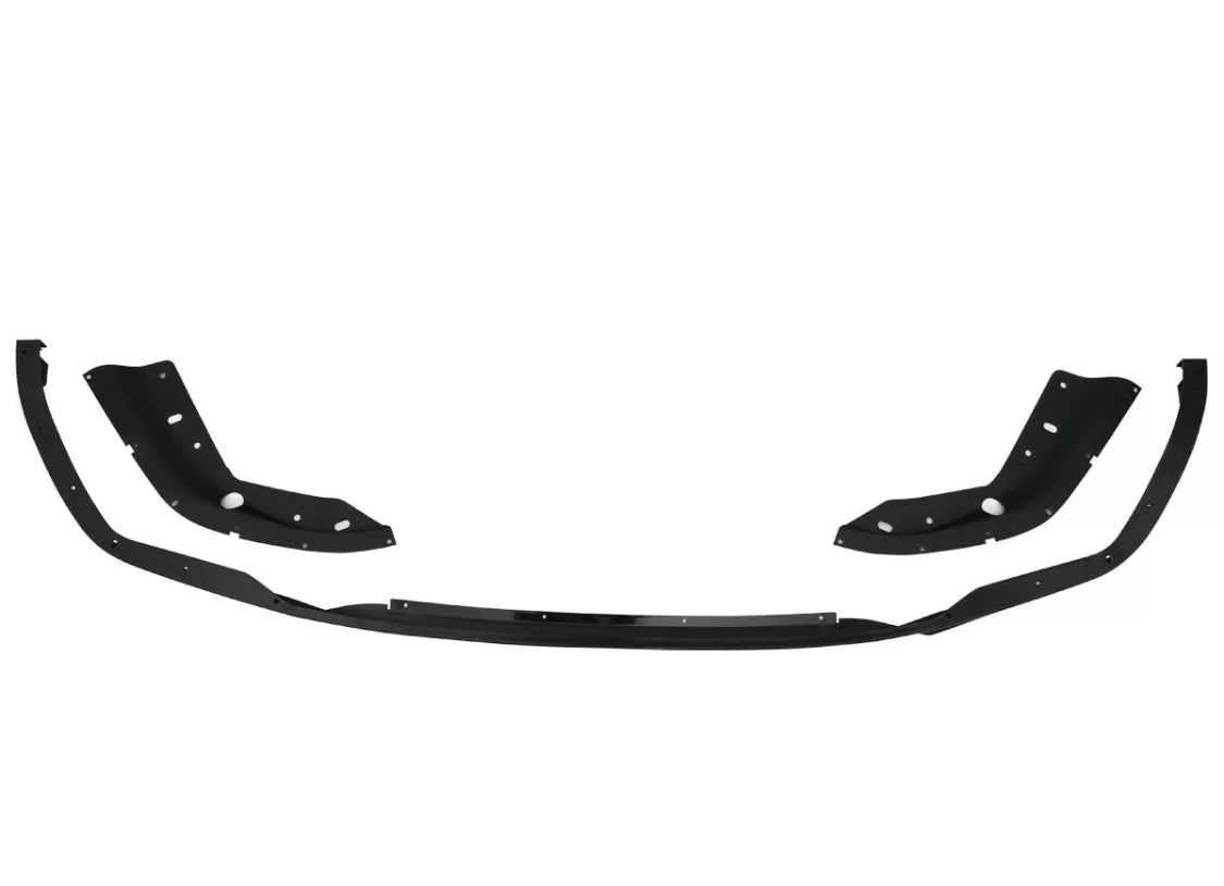 Black car body kit with curved sections and multiple drilled holes, positioned on a plain white background, suggesting automotive modification or repair use.