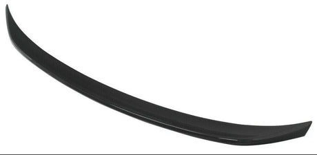 A black, curved car spoiler made of carbon fiber material is displayed against a plain white background.