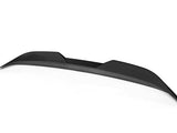 Black carbon fiber car spoiler with a textured surface, arched design, and pointed edges, positioned against a plain white background.