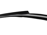 A black carbon fiber car spoiler extends horizontally, designed for aerodynamic efficiency, set against a plain white background.
