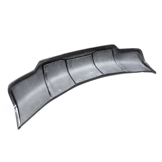 A curved, black carbon fiber rear diffuser with aerodynamic design sits against a white background, featuring multiple fins and a textured surface for enhanced vehicle performance.