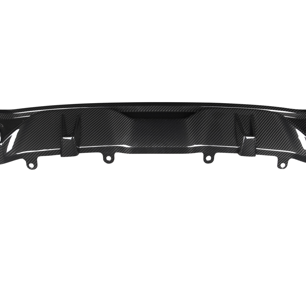 A carbon fiber rear diffuser with multiple fins is positioned horizontally, intended for aerodynamic improvement in a vehicle setting. The background is plain and white.