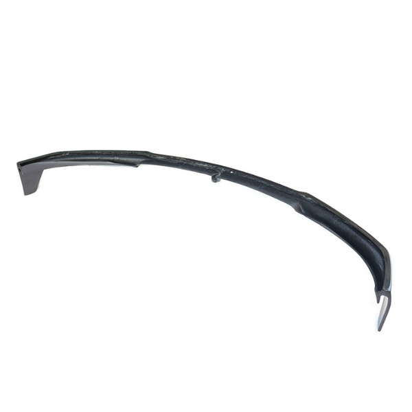 A long, curved carbon fiber object is displayed against a plain white background, showcasing its sleek, aerodynamic design.