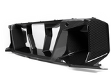 A carbon fiber car grille with angular vents is displayed on a plain white background, showcasing its glossy texture and intricate design.