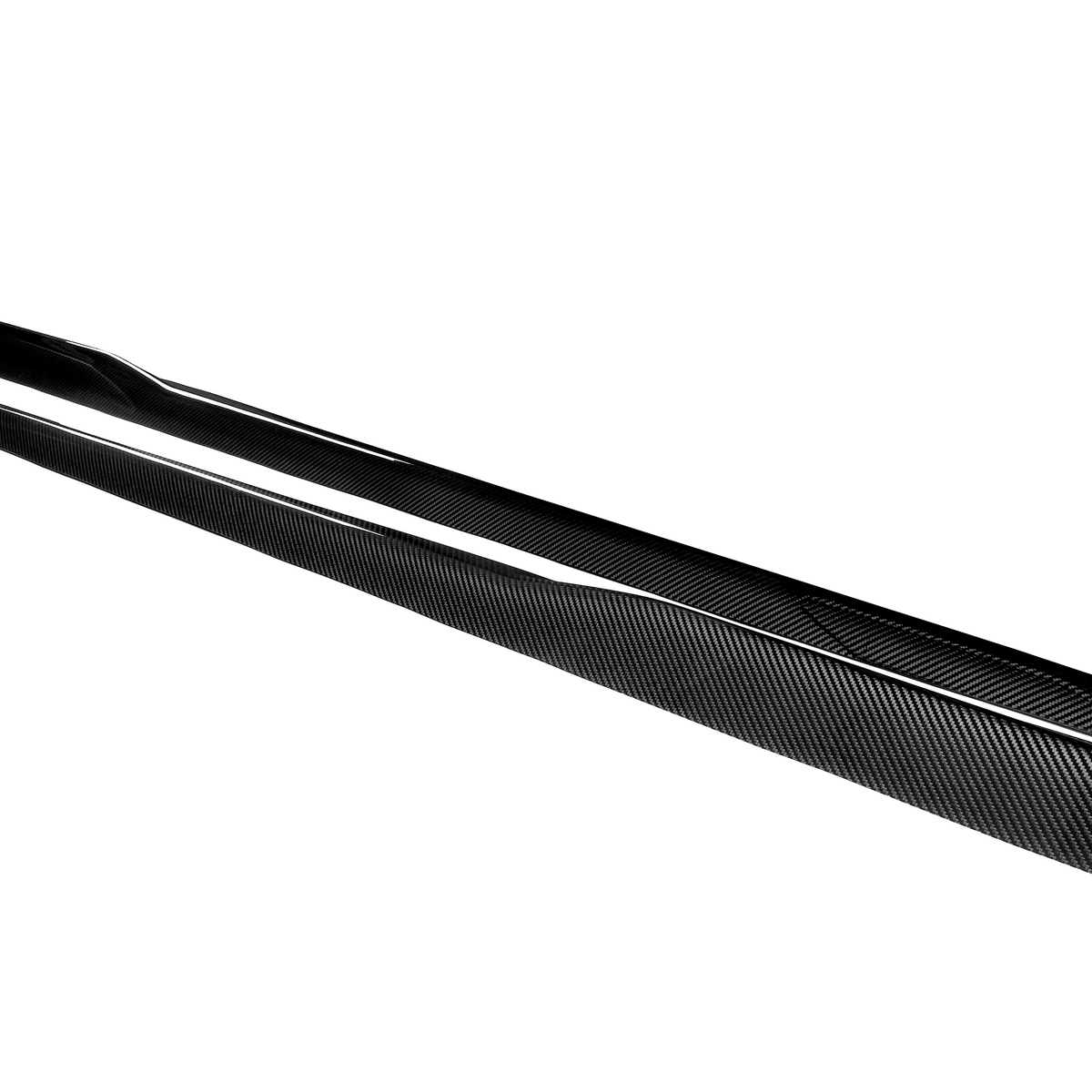 Two elongated, black carbon fiber car-side skirts lay parallel on a white surface, emphasizing their sleek, aerodynamic design.