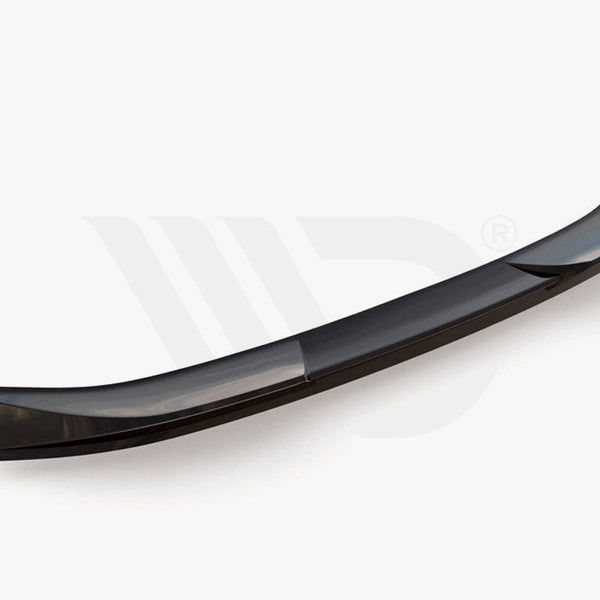 A sleek, curved car spoiler rests on a plain white background. Below, the text reads: "WORLDWIDE LEADER IN AERODYNAMIC COMPONENTS."