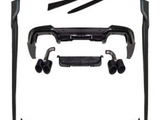 A set of black car body kit components, including bumpers, side skirts, and exhaust tips, are arranged on a white background, showcasing various parts for vehicle customization.