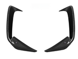 Two carbon fiber car aerodynamic fins pointing inward, set against a white background, with mounting holes visible along the edges.