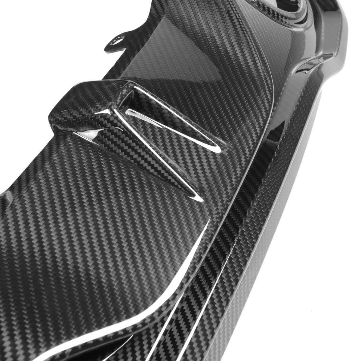 A glossy carbon fiber car part with aerodynamic fins is shown against a plain white background, emphasizing its sleek and modern design.