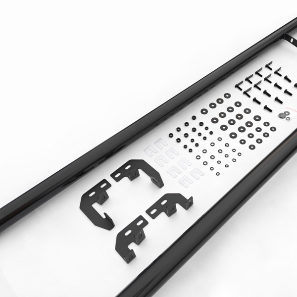 Black metal brackets and various screws are arranged neatly inside a black frame on a white surface, suggesting components for assembly, possibly for manufacturing or construction purposes.