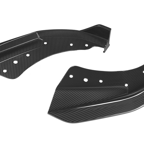Two black carbon fiber automotive winglets with multiple circular cutouts rest against a white background, showcasing a sleek, aerodynamic design.