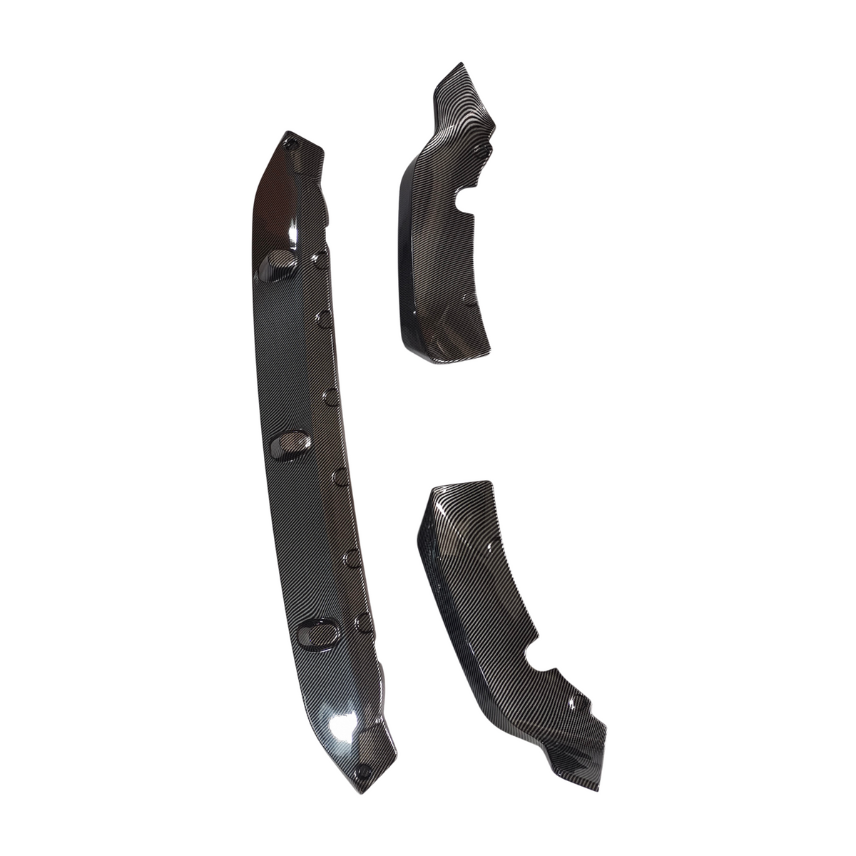 Three carbon fiber vehicle body parts with a sleek, polished finish are arranged separately, showcasing their textured surfaces against a plain white background.