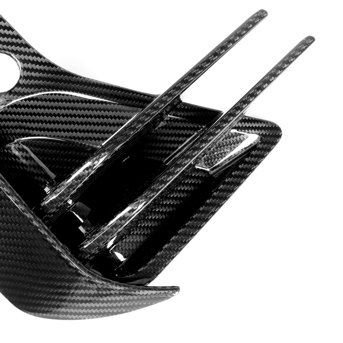 Carbon fiber component with sleek fins extending outward, set against a plain white background, showcasing a glossy, textured surface.