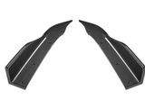 Two elongated, symmetrical carbon fiber components with curved edges and drilled holes are positioned facing each other against a plain, white background.